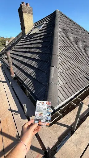 Dark tile hip roof on a 1930s semi, finished, flyer in shot